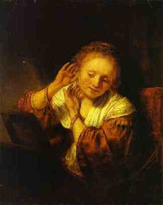 一位年轻女子试戴耳饰 A Young Woman Trying on Earings (1657)，伦勃朗
